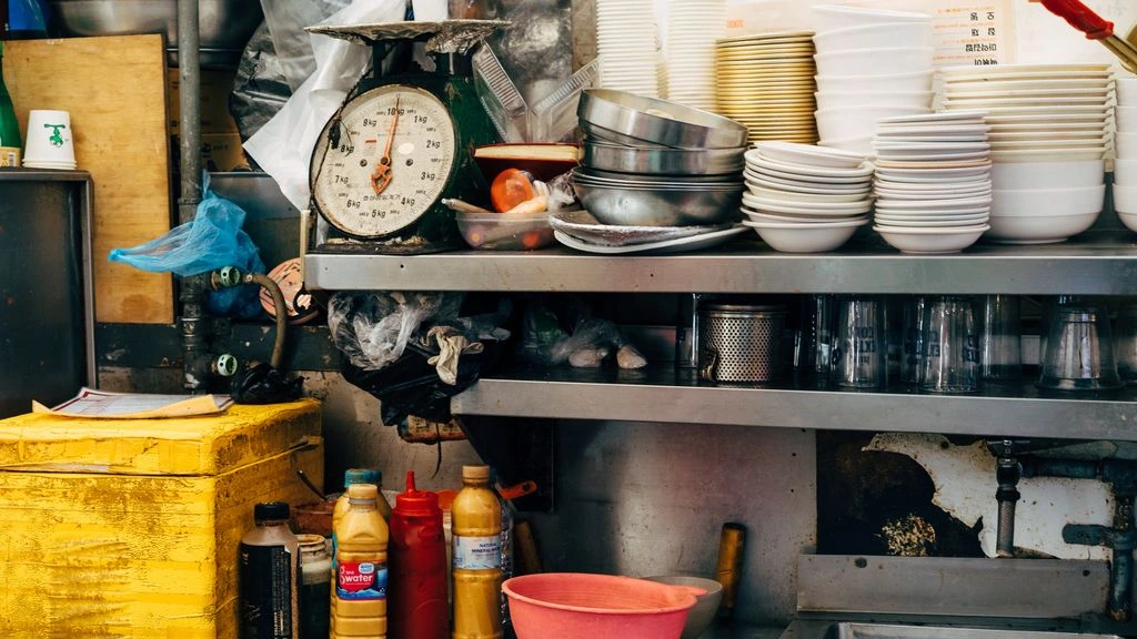 A reader works through a personal finance spreadsheet at home